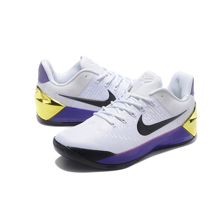 white and purple basketball shoes