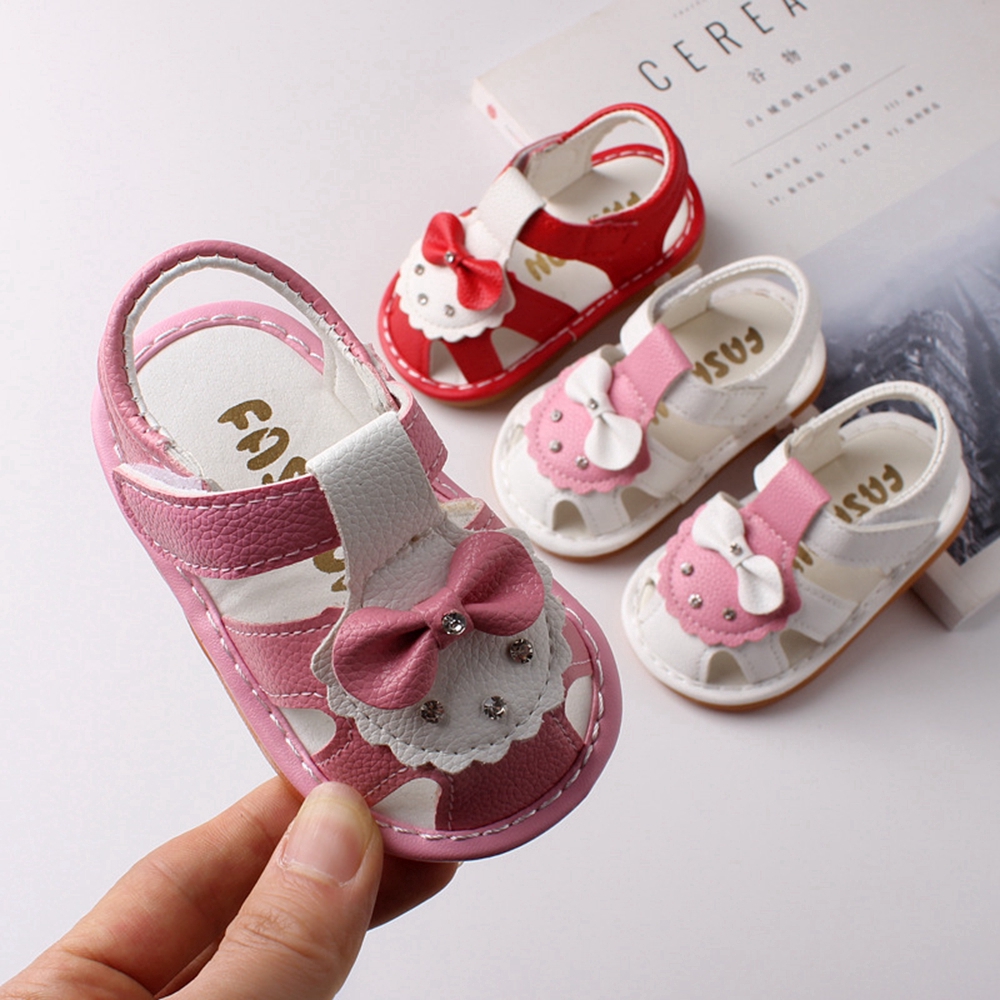 white newborn sandals