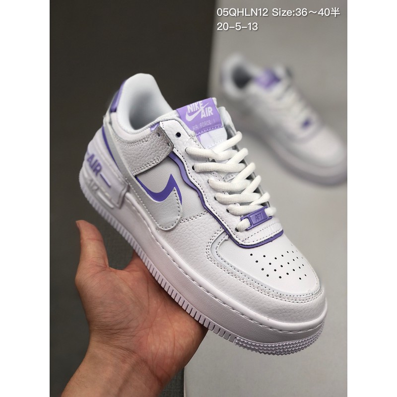 purple and white nike shoes