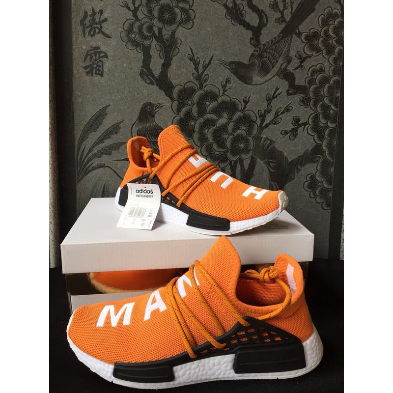 orange human race shoes