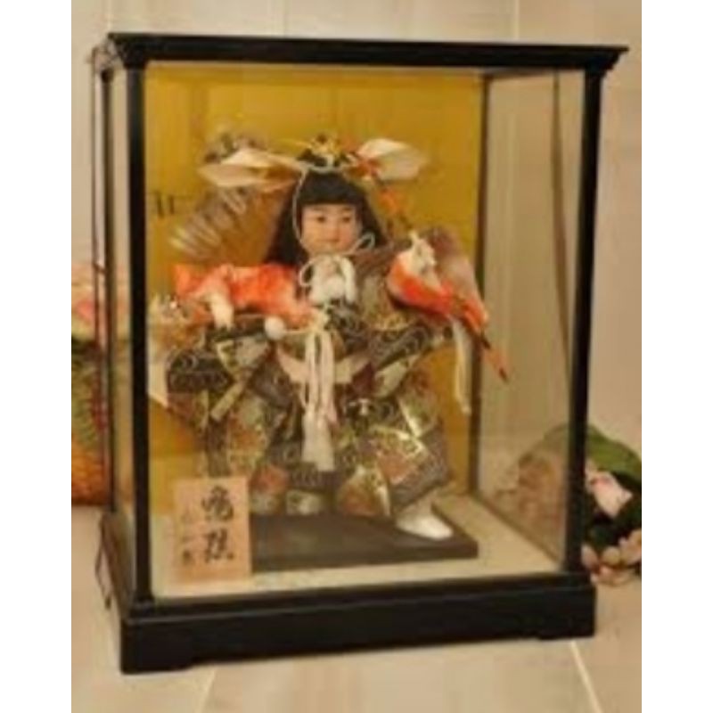 japanese doll in glass case