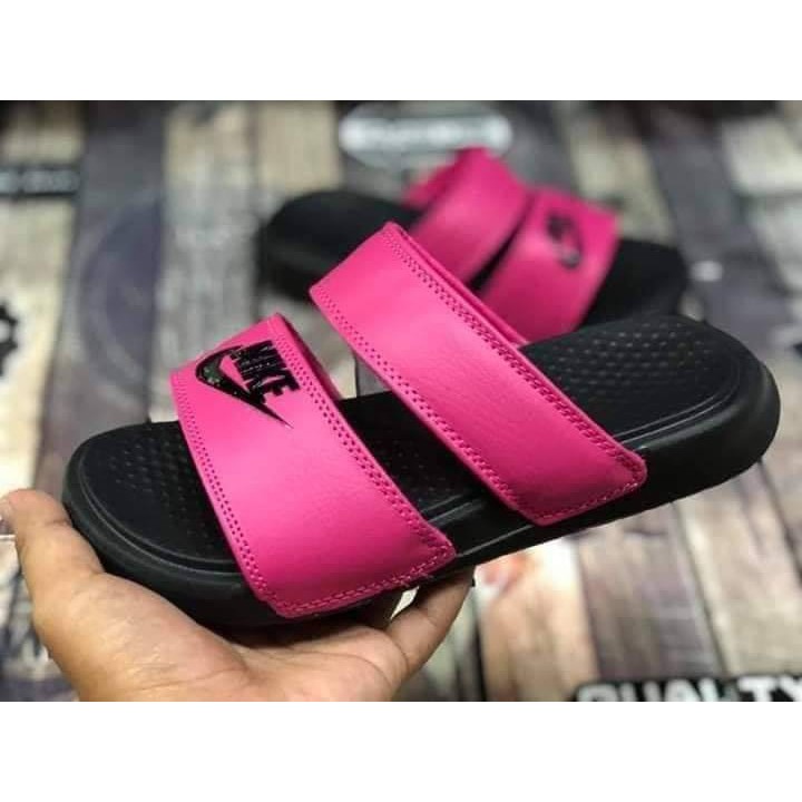 black and pink nike sliders