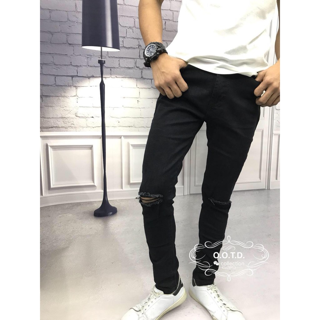 black knee cut skinny jeans