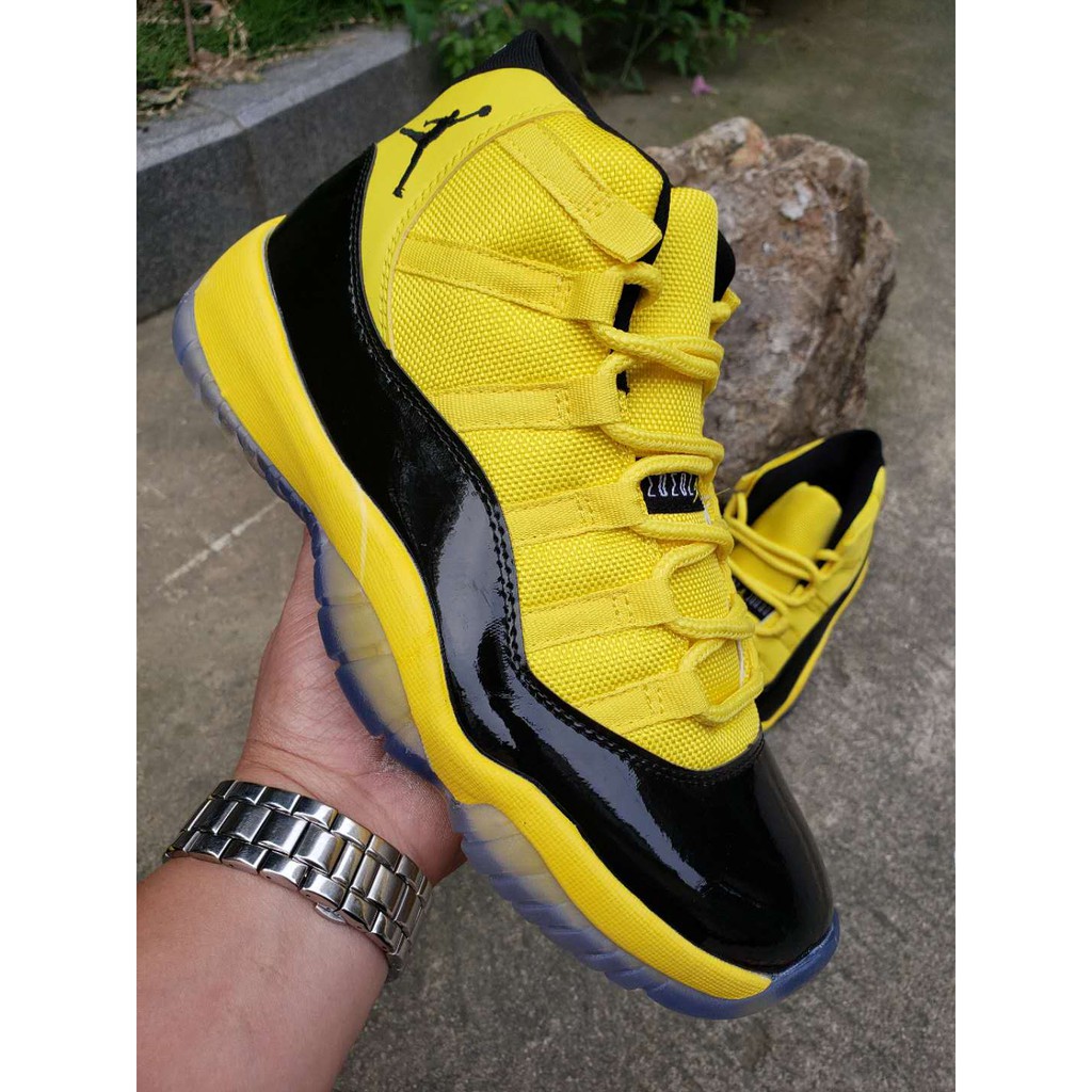 black and yellow jordan 11