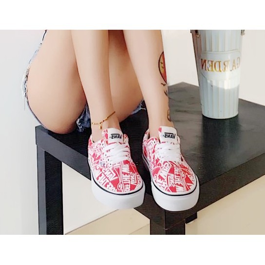 red vans with white writing