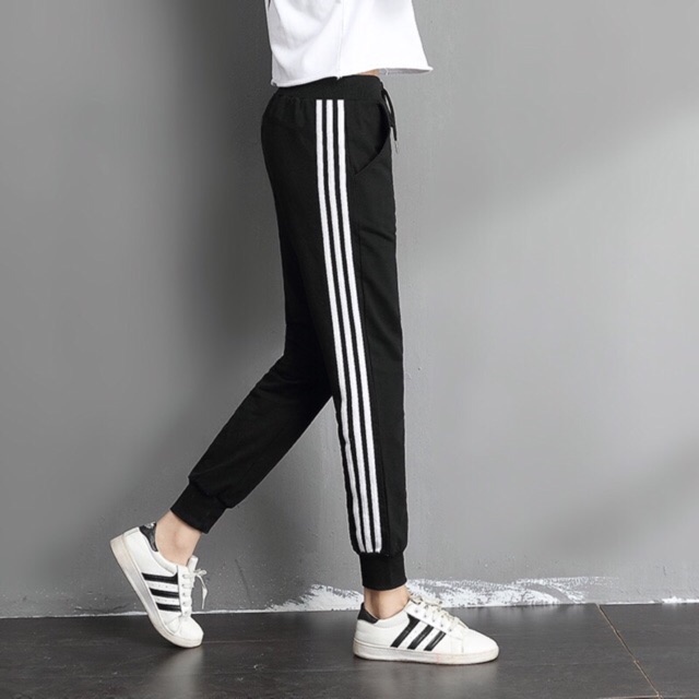 grey joggers with white stripe