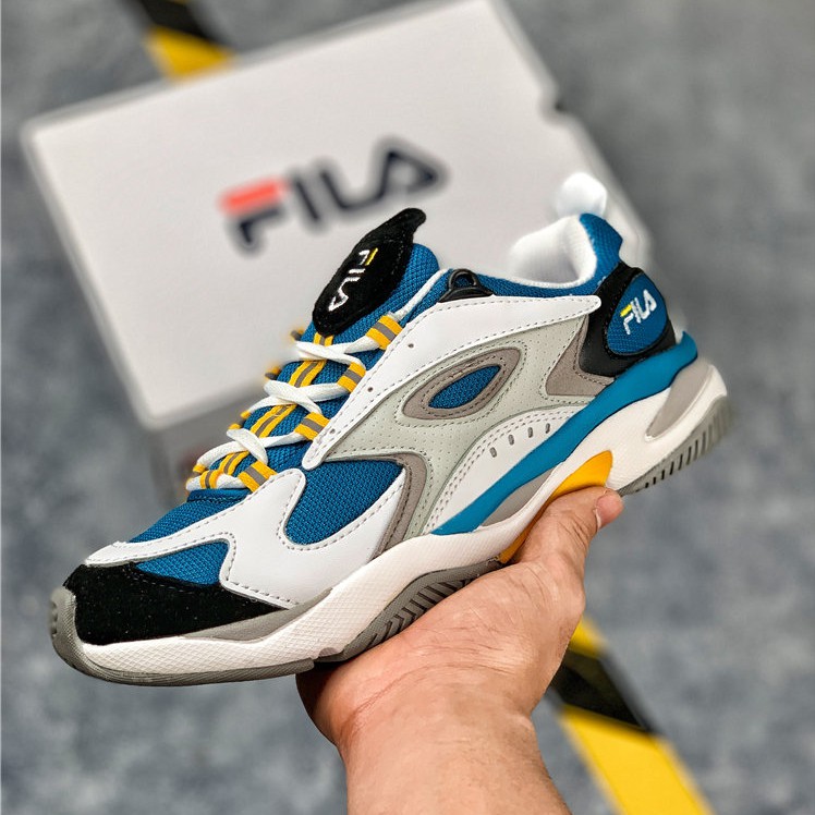 white and blue fila shoes