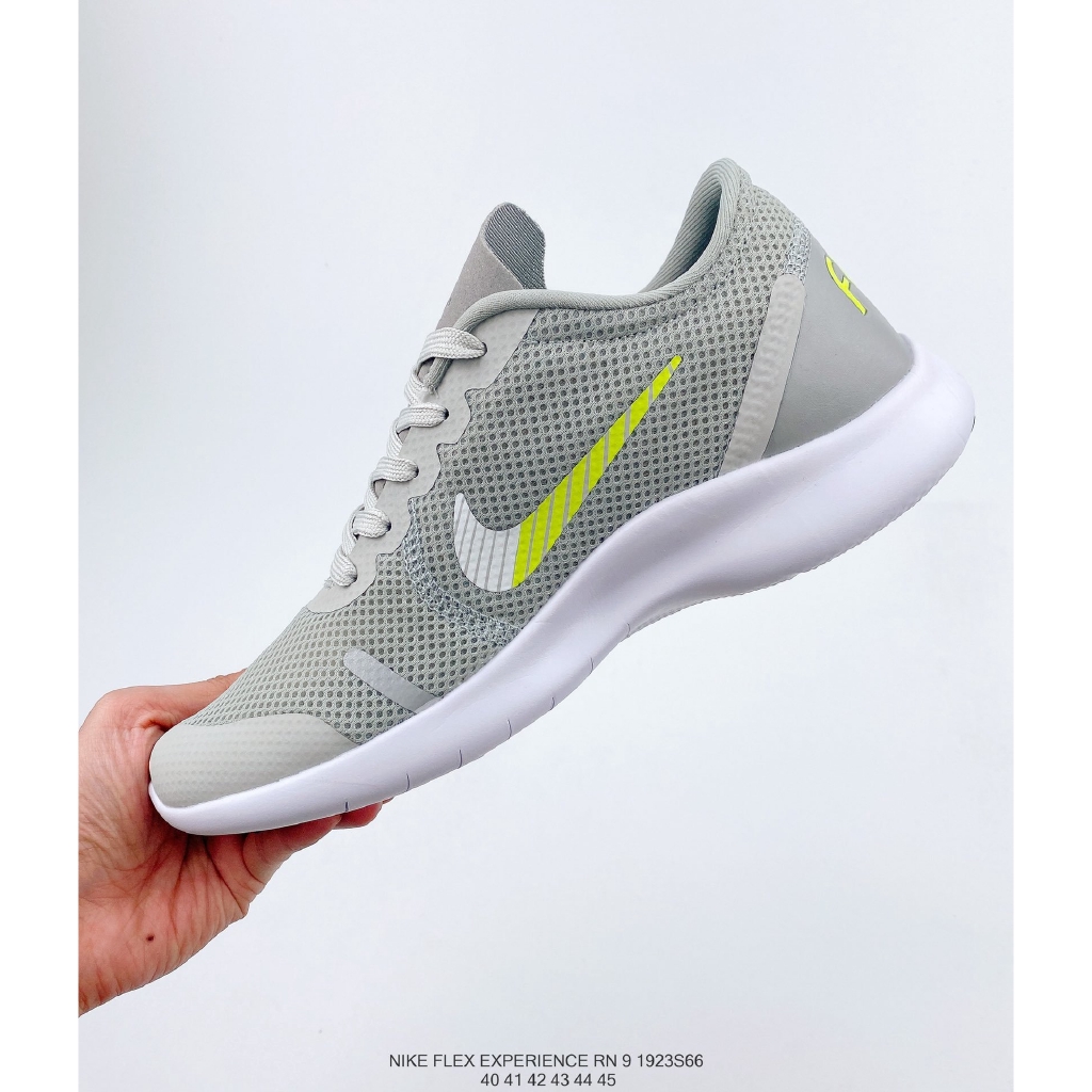 gray and green nike shoes