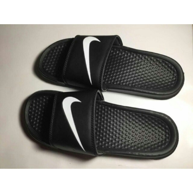 white and black nike slippers