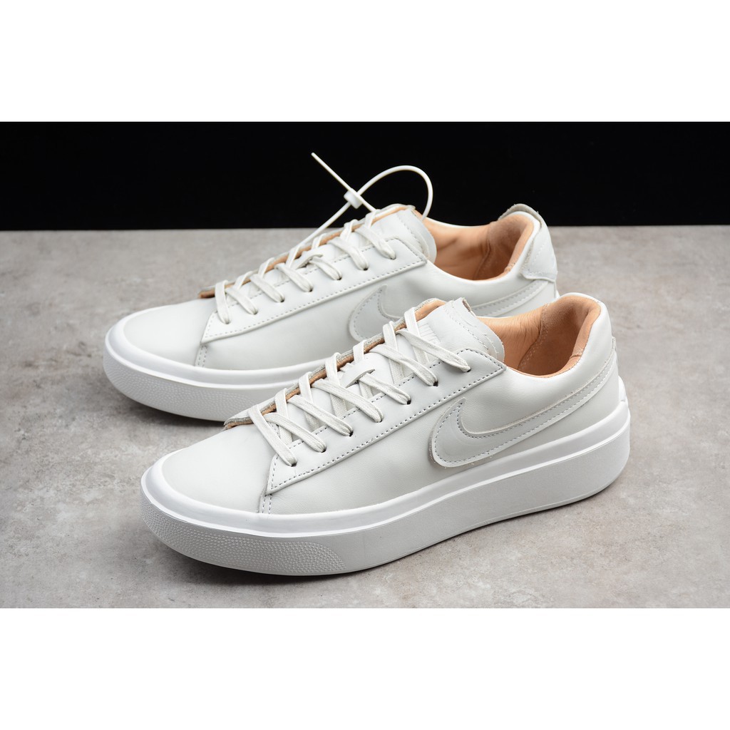 white nike flat shoes 