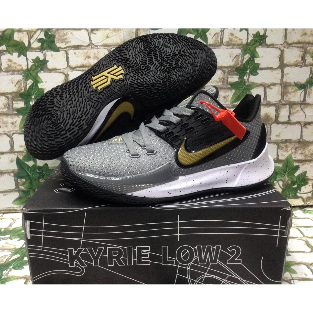 kyrie low black and gold