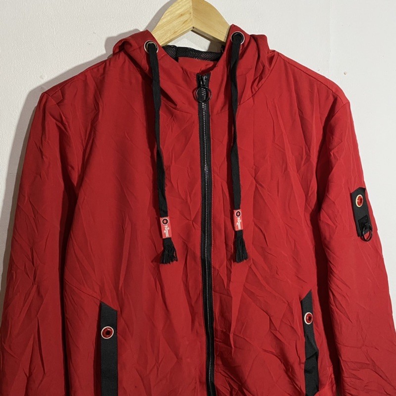 red zip up windbreaker