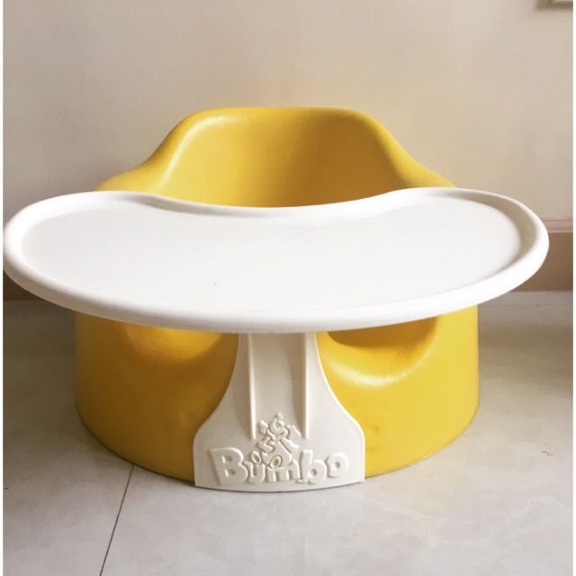 yellow bumbo seat with tray