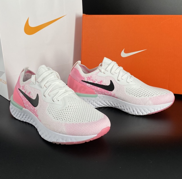 white and pink running shoes