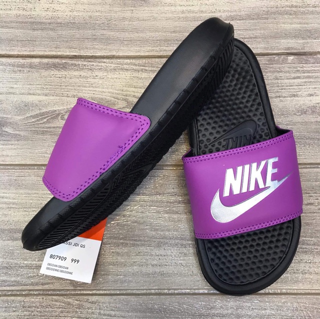 purple nike slip ons