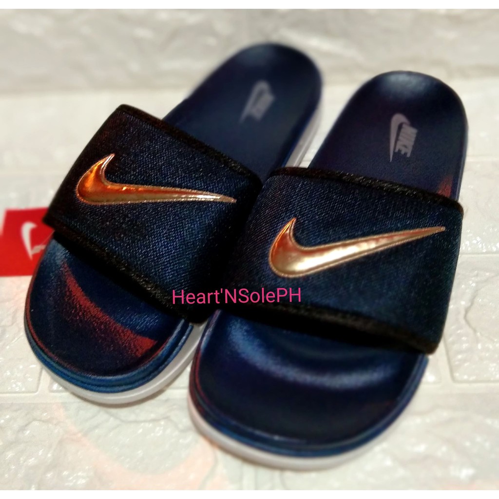 blue and gold nike slides