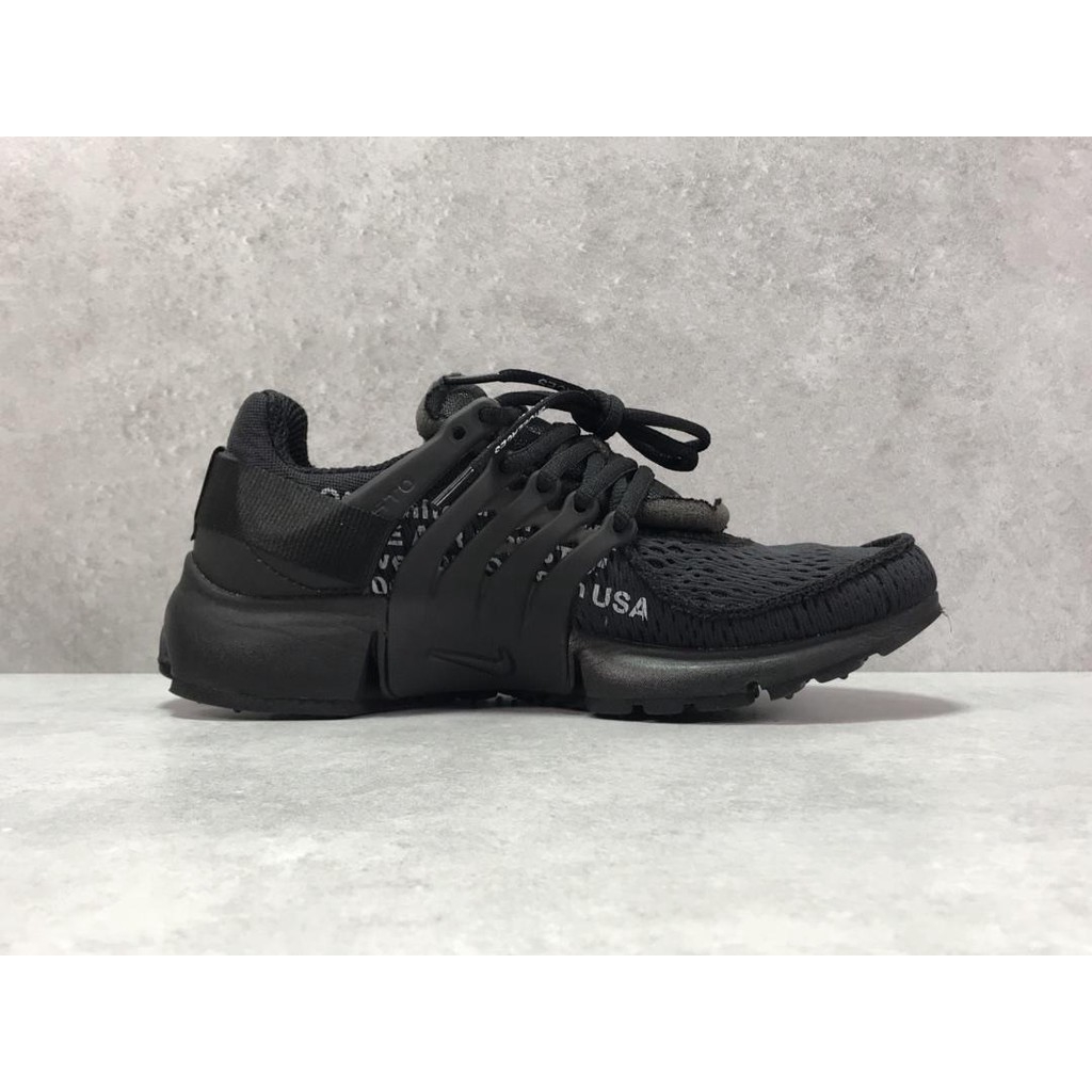 branded black sports shoes