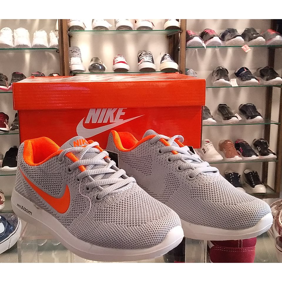 orange and grey nike running shoes