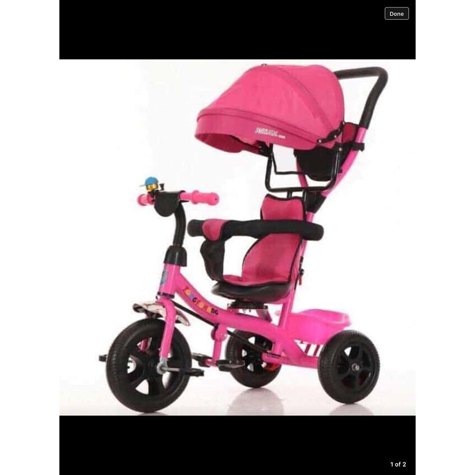 pink tricycle with push handle