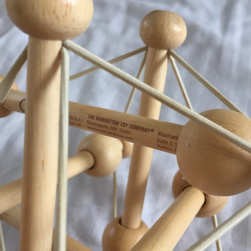 manhattan toy skwish natural rattle and teether grasping activity toy