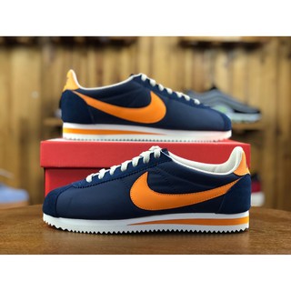 navy blue leather cortez