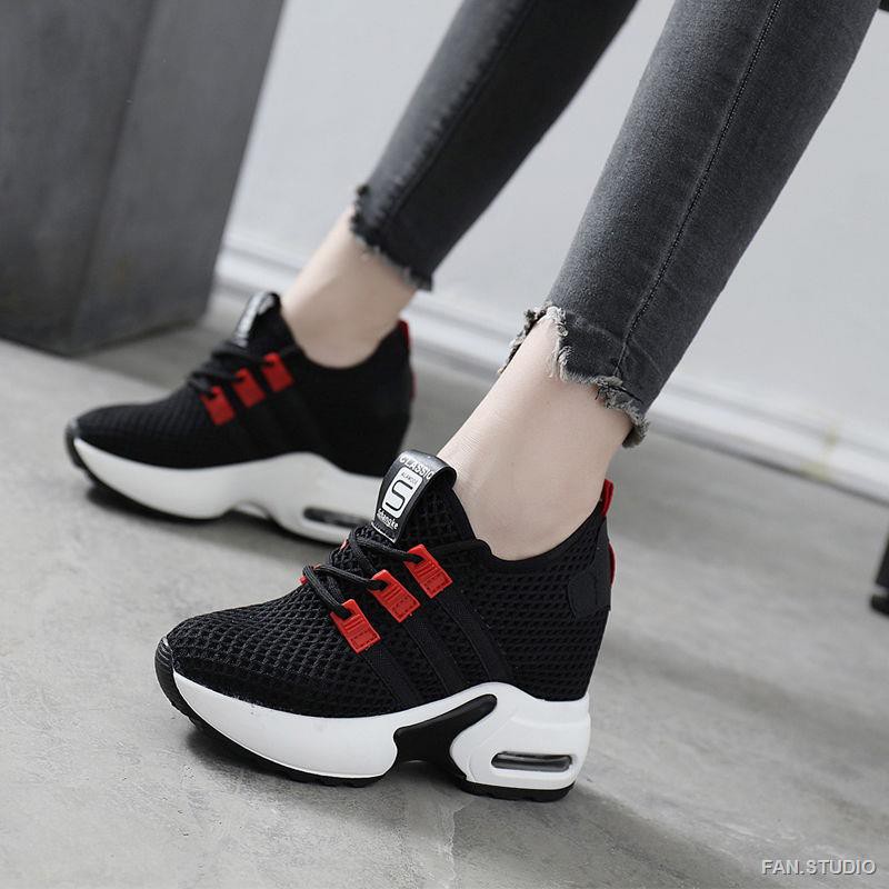 white sneakers with black heel