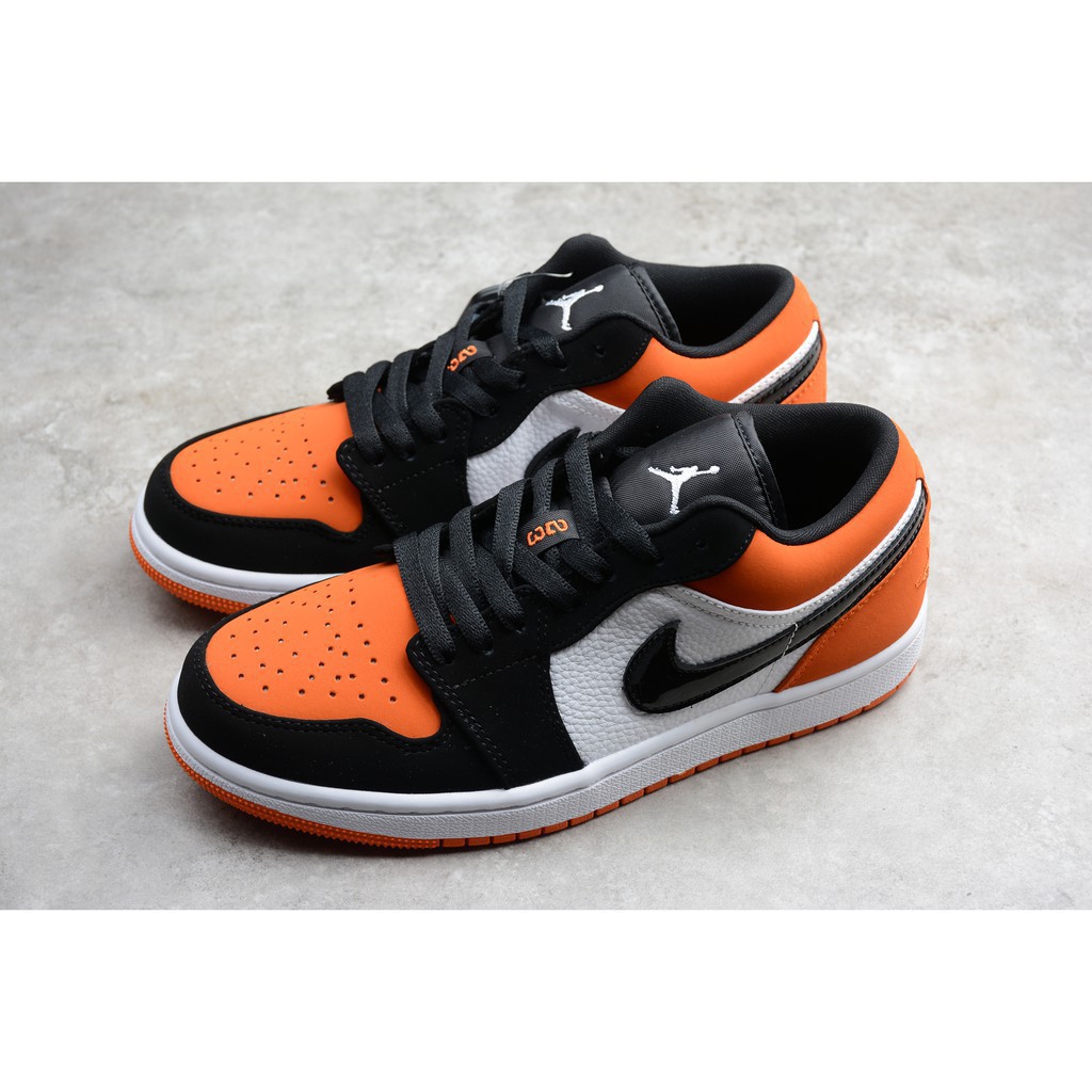 orange and black jordan 1 low