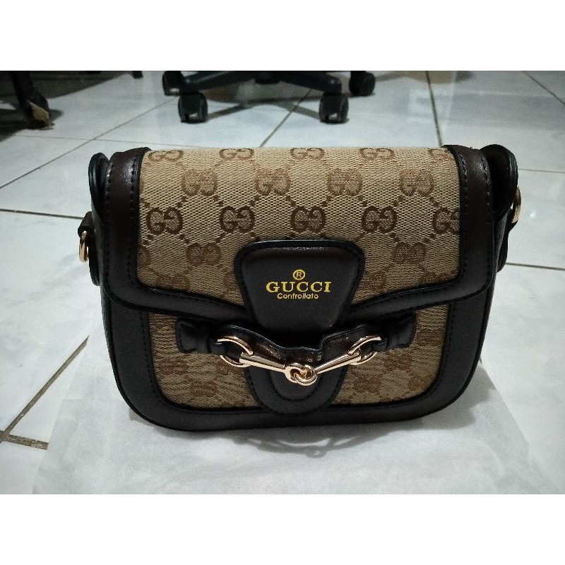 GUCCI HORSEBIT SADDLE CROSSBODY BAG IN WEB STRIPE MATERIAL DESIGN