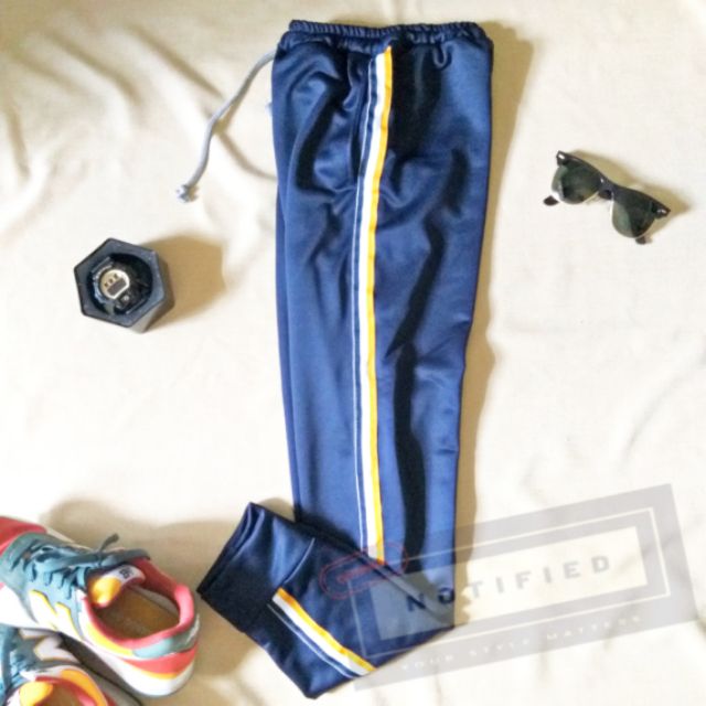 blue pants with yellow stripe