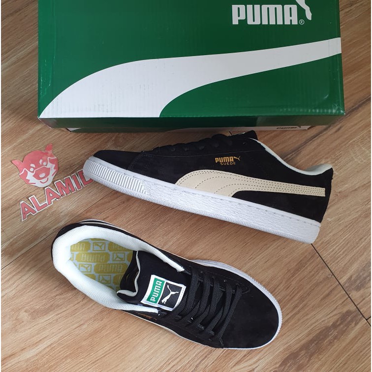 white and gold puma shoes