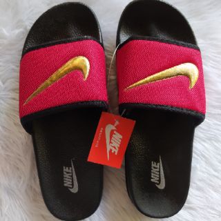 red nike sandals with gold check