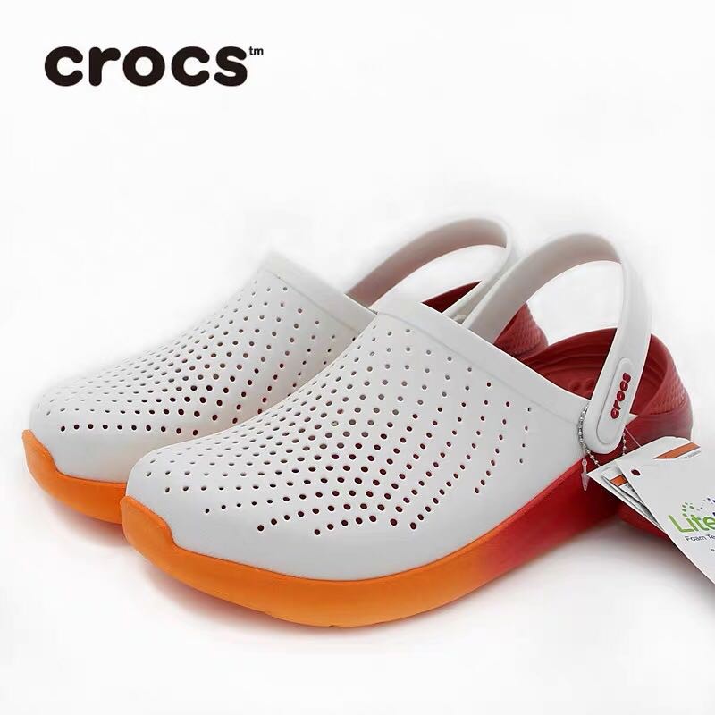 white and orange crocs