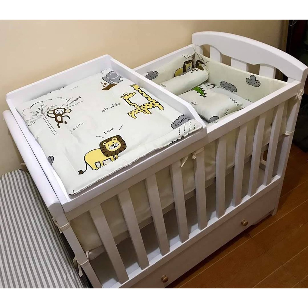wooden crib with drawers