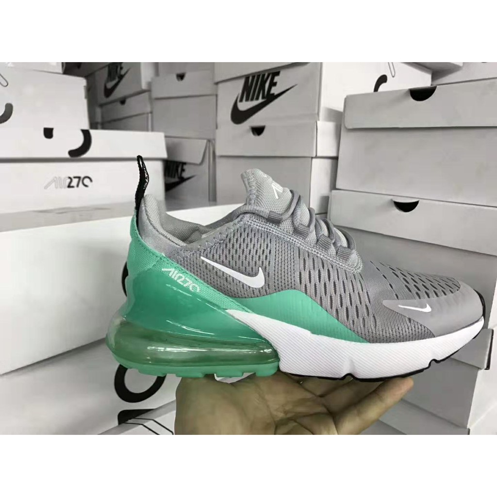 green and gray nike shoes