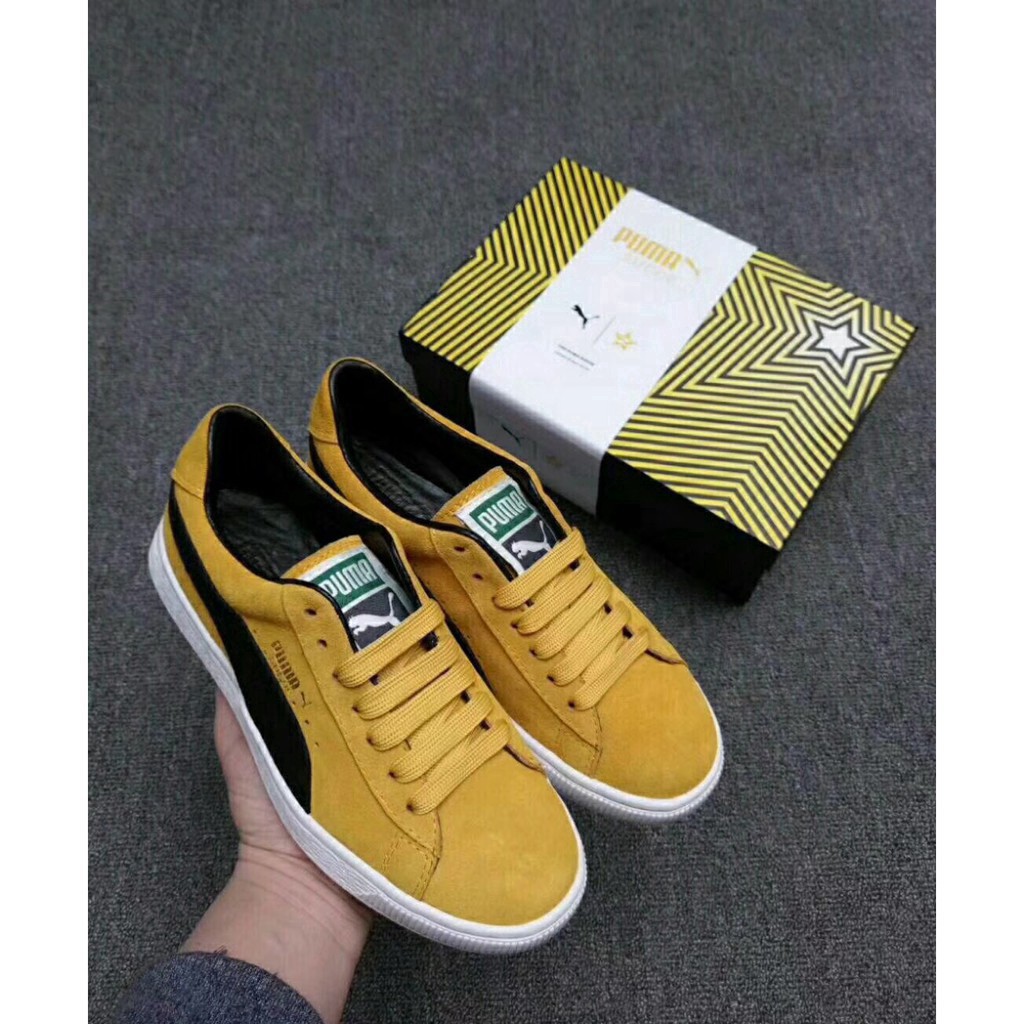 black and yellow puma suede