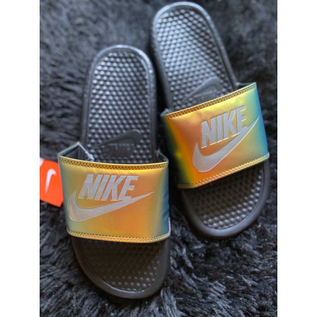 new nike slides with gold check