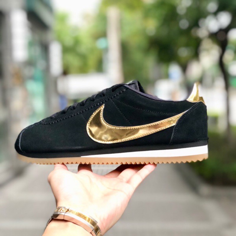 nike black and gold cortez trainers