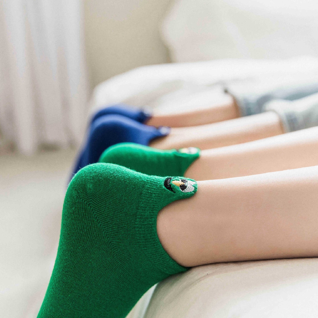 trainer socks with faces on the back