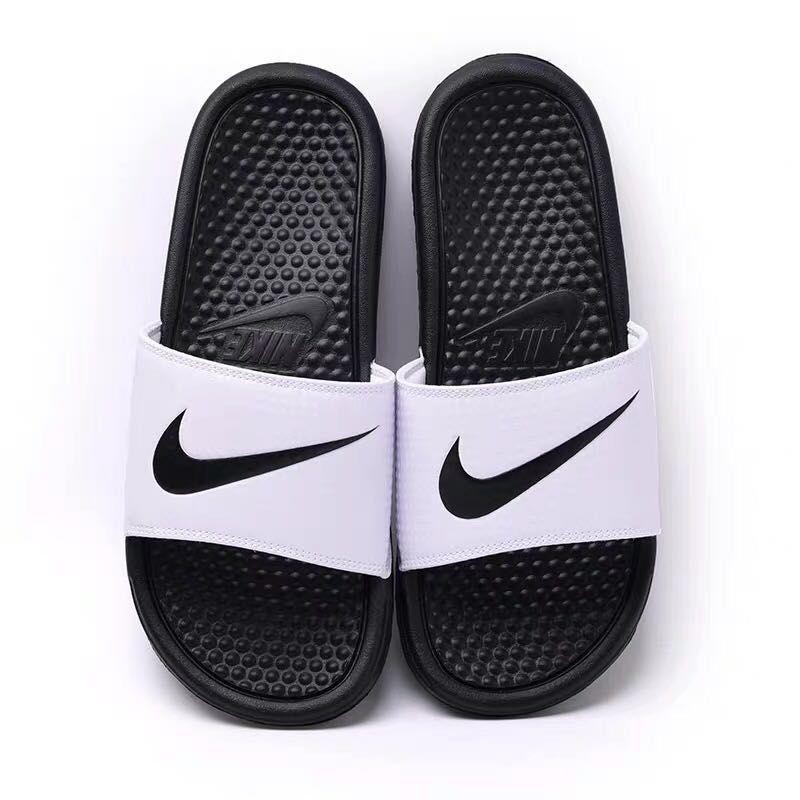 white and black nike slippers