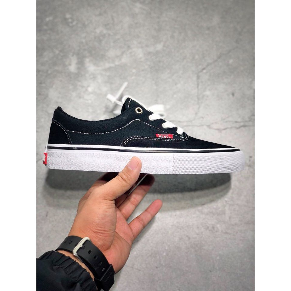 red and black and white vans