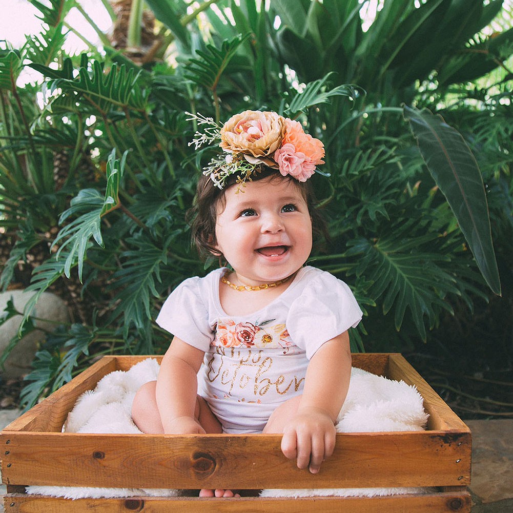 baby with flower crown