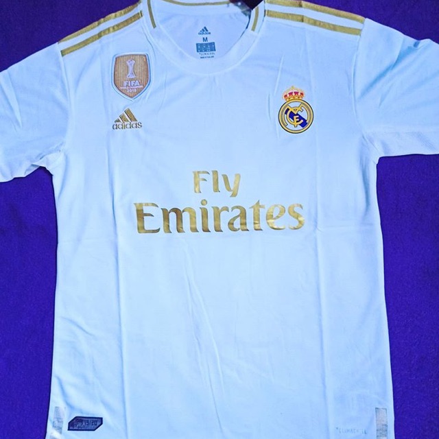 white and gold soccer jersey