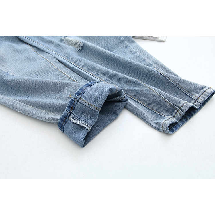 light blue jeans with holes