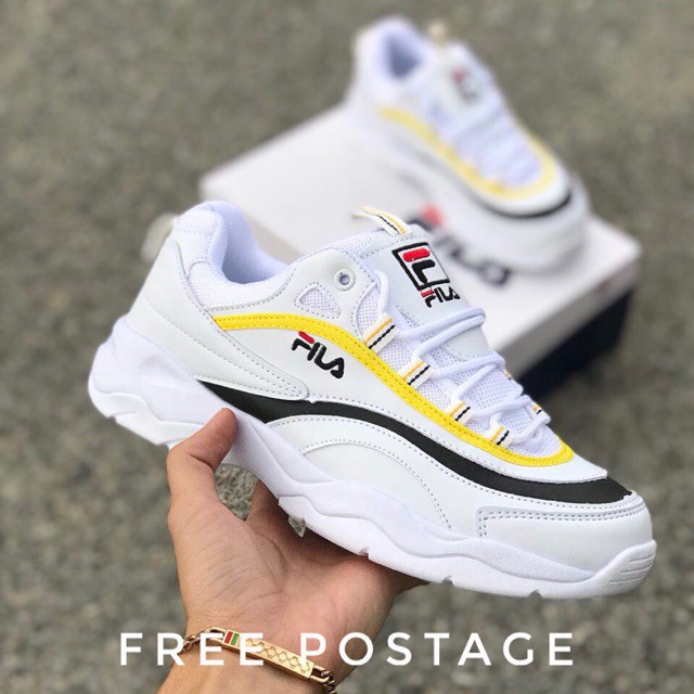 fila black yellow shoes