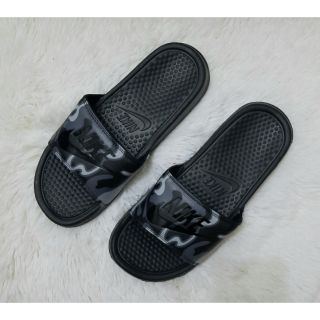 gray and white nike slides