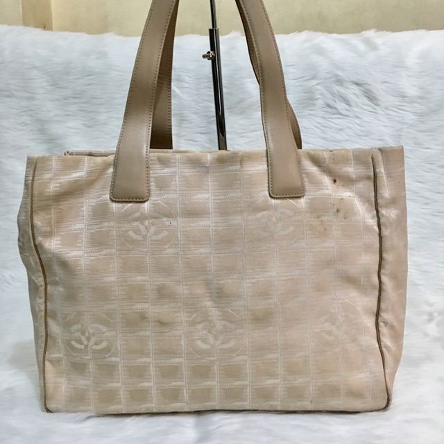 beige travel bag