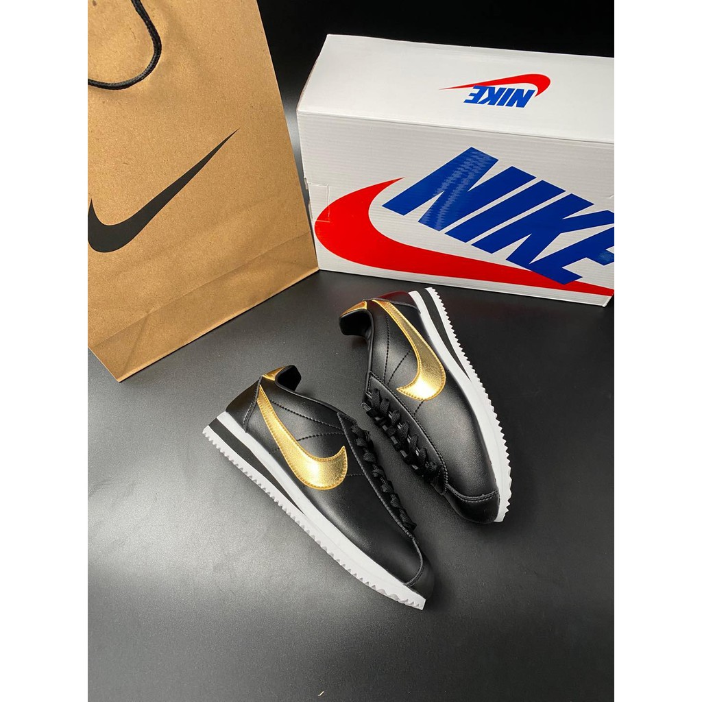 nike cortez ultra black gold