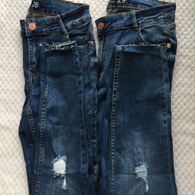 skinny mid waist destroyed jeans