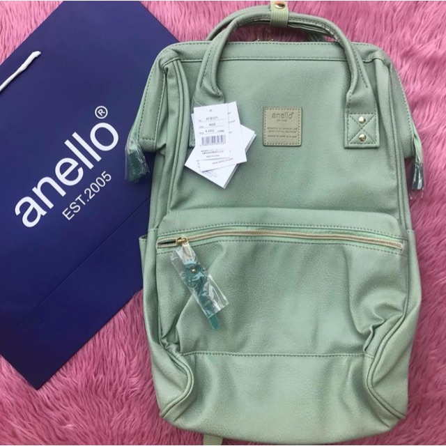 green leather backpack