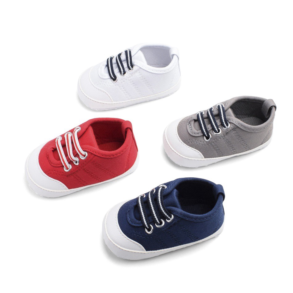 white canvas baby shoes